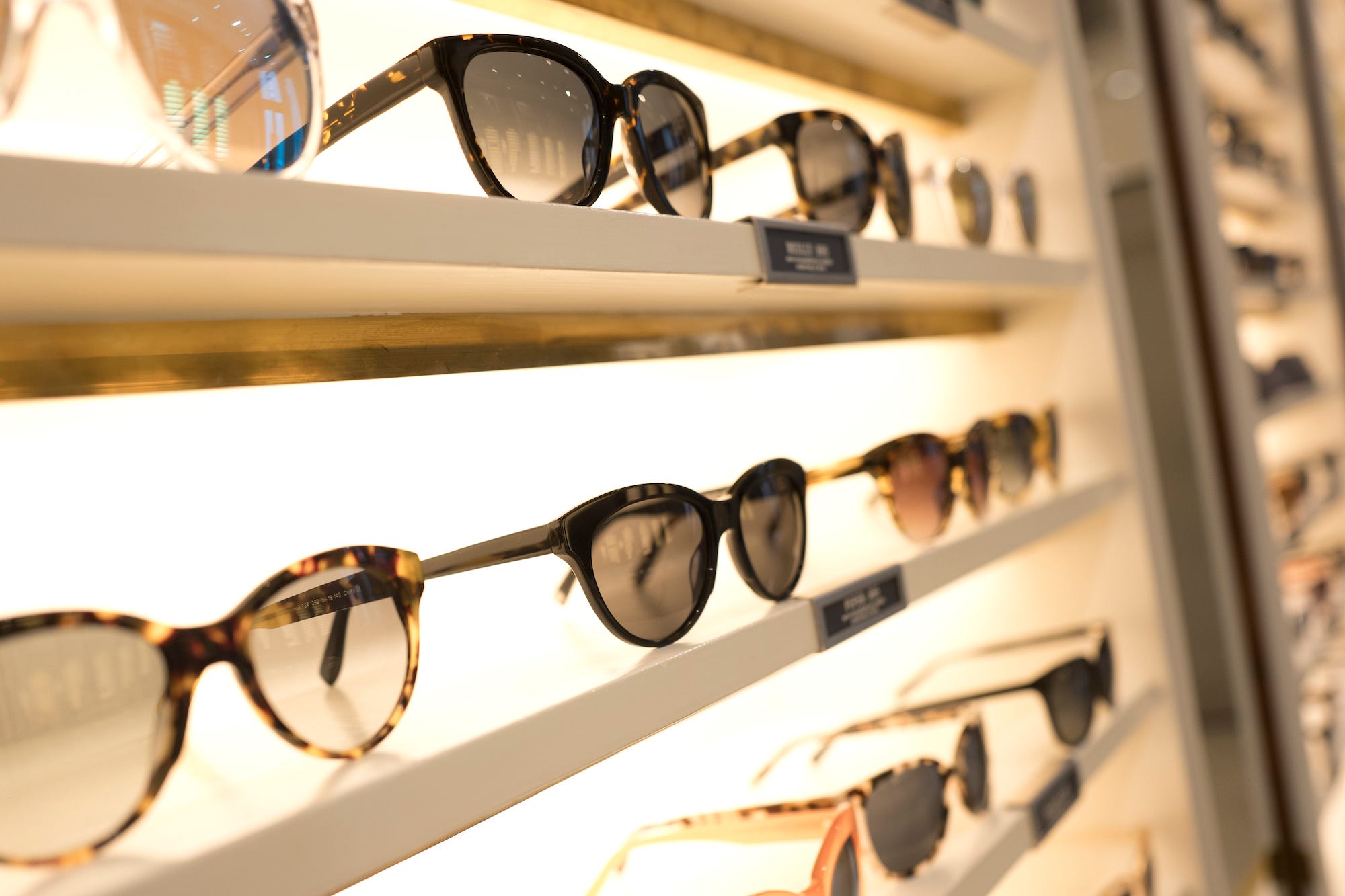 Warby Parker eyeglasses are seen on a display rack in one of the company's retail stores.