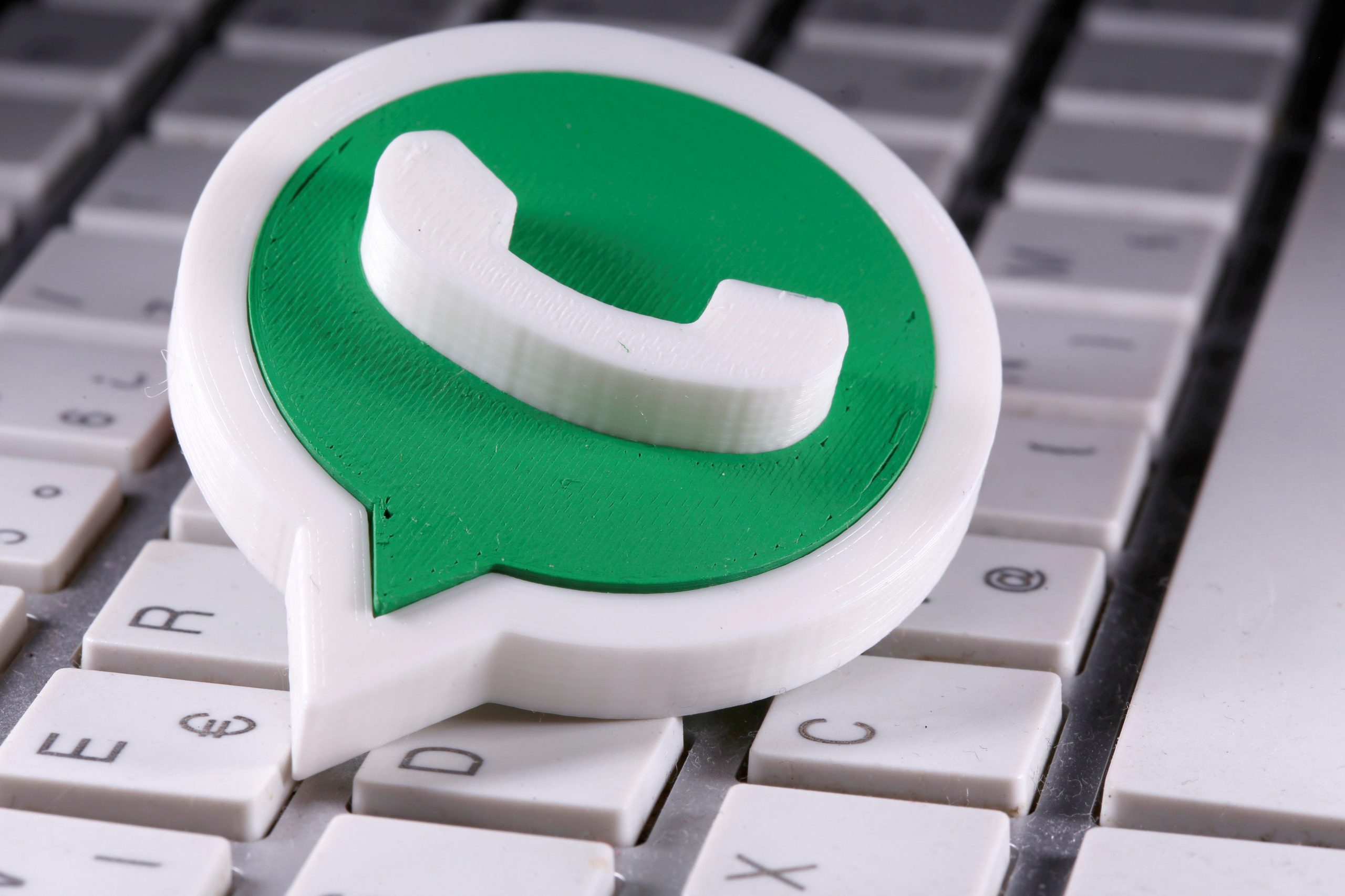 FILE PHOTO: A 3D printed Whatsapp logo is placed on the keyboard in this illustration taken April 12, 2020. REUTERS/Dado Ruvic/Illustration