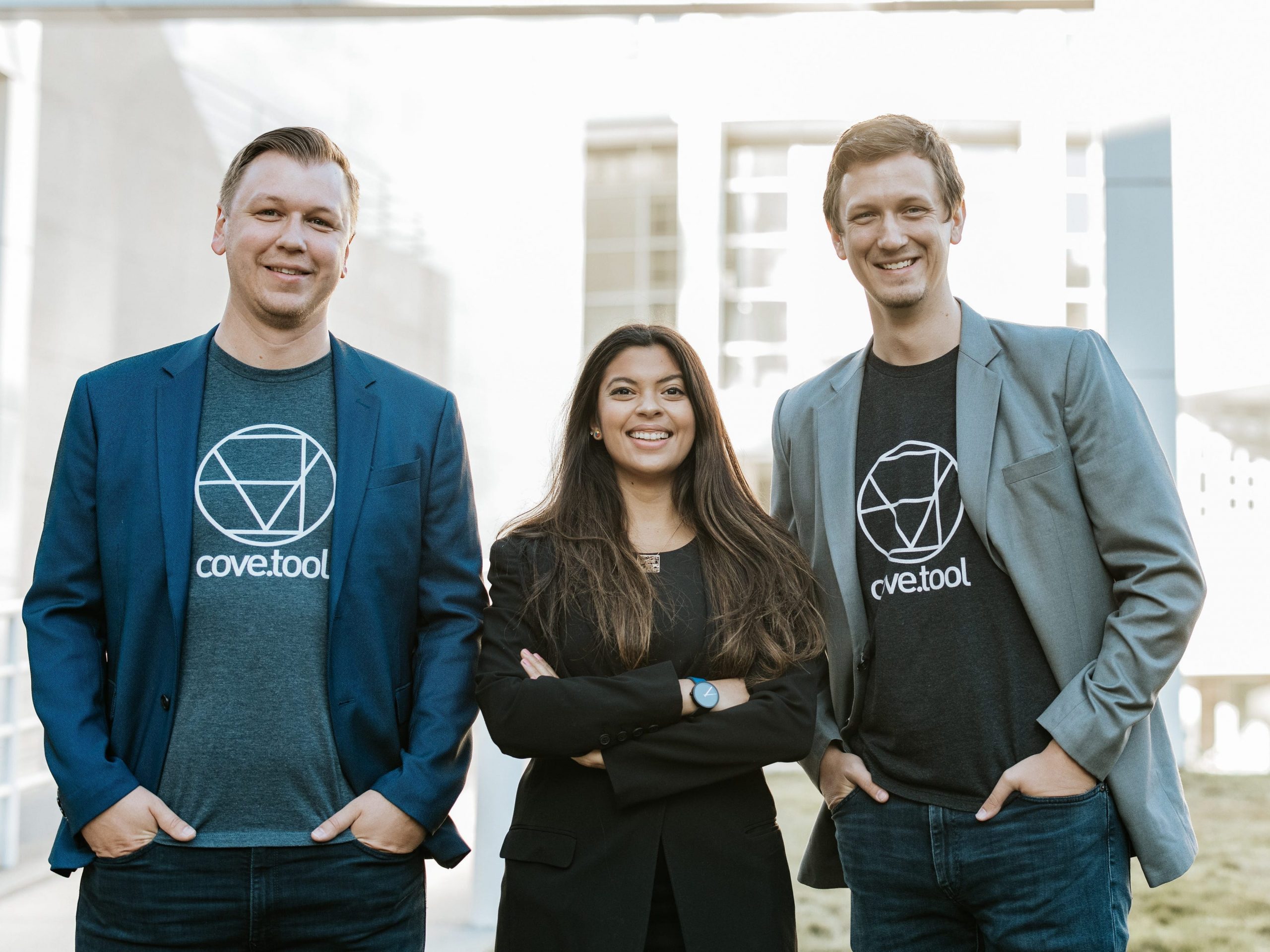 Cove.tool founders (from left) Sandeep Ahuja, Patrick Chopson and Daniel Chopson. They're smiling and wearing Cove.tool shirts and blazers.