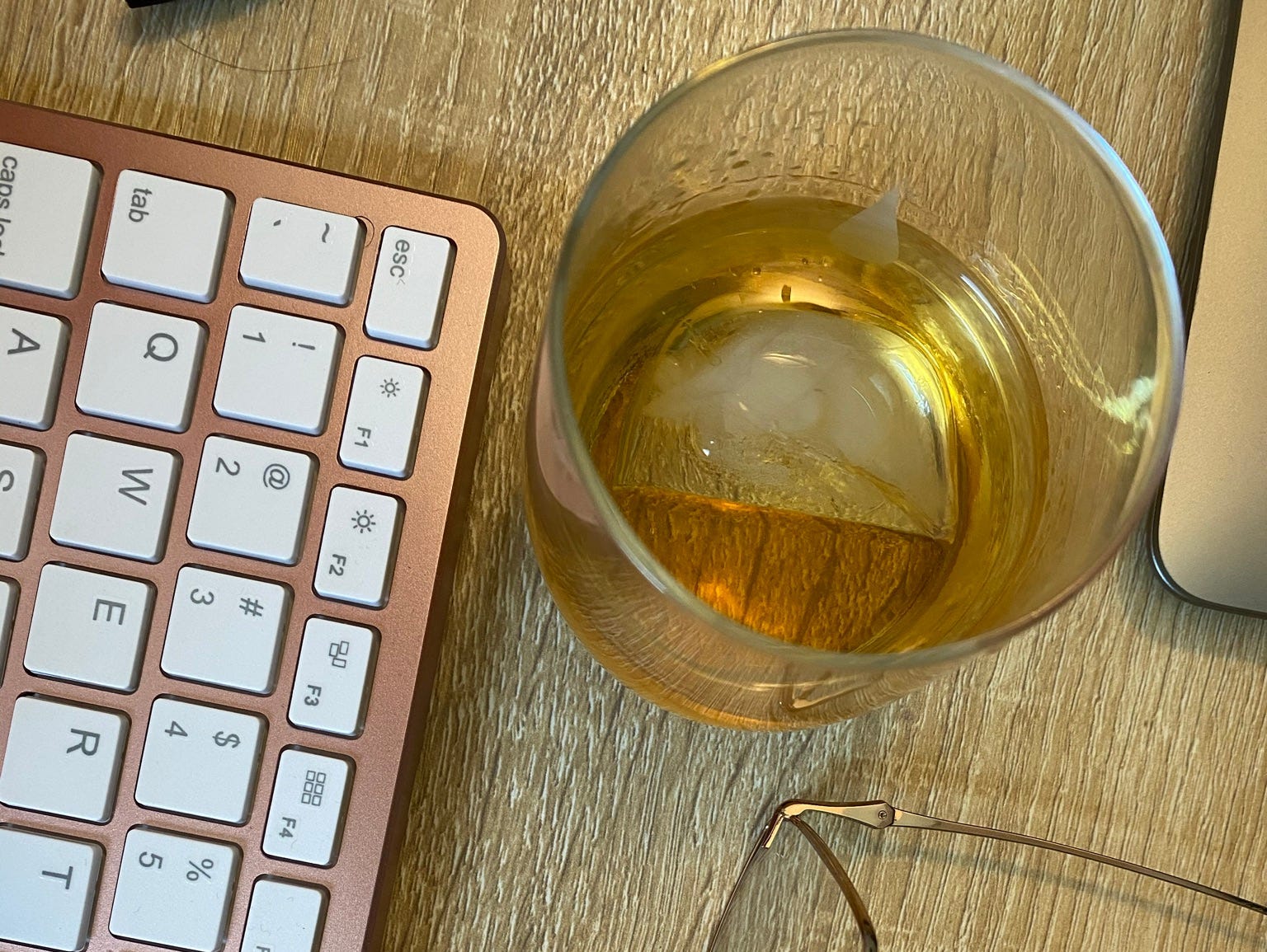 Whiskey, glasses, and a keyboard