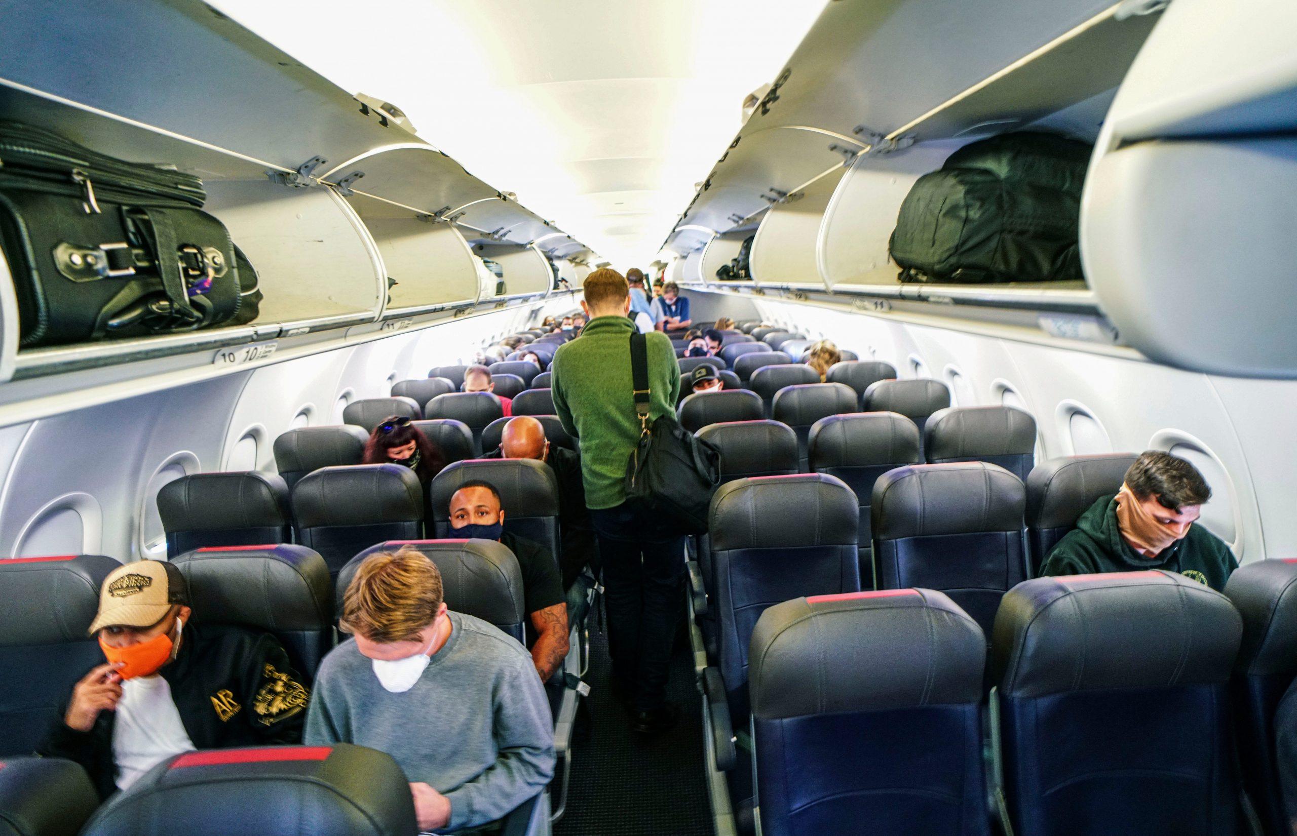 Passengers sit in an American Airlines airplane before flying from California to North Carolina