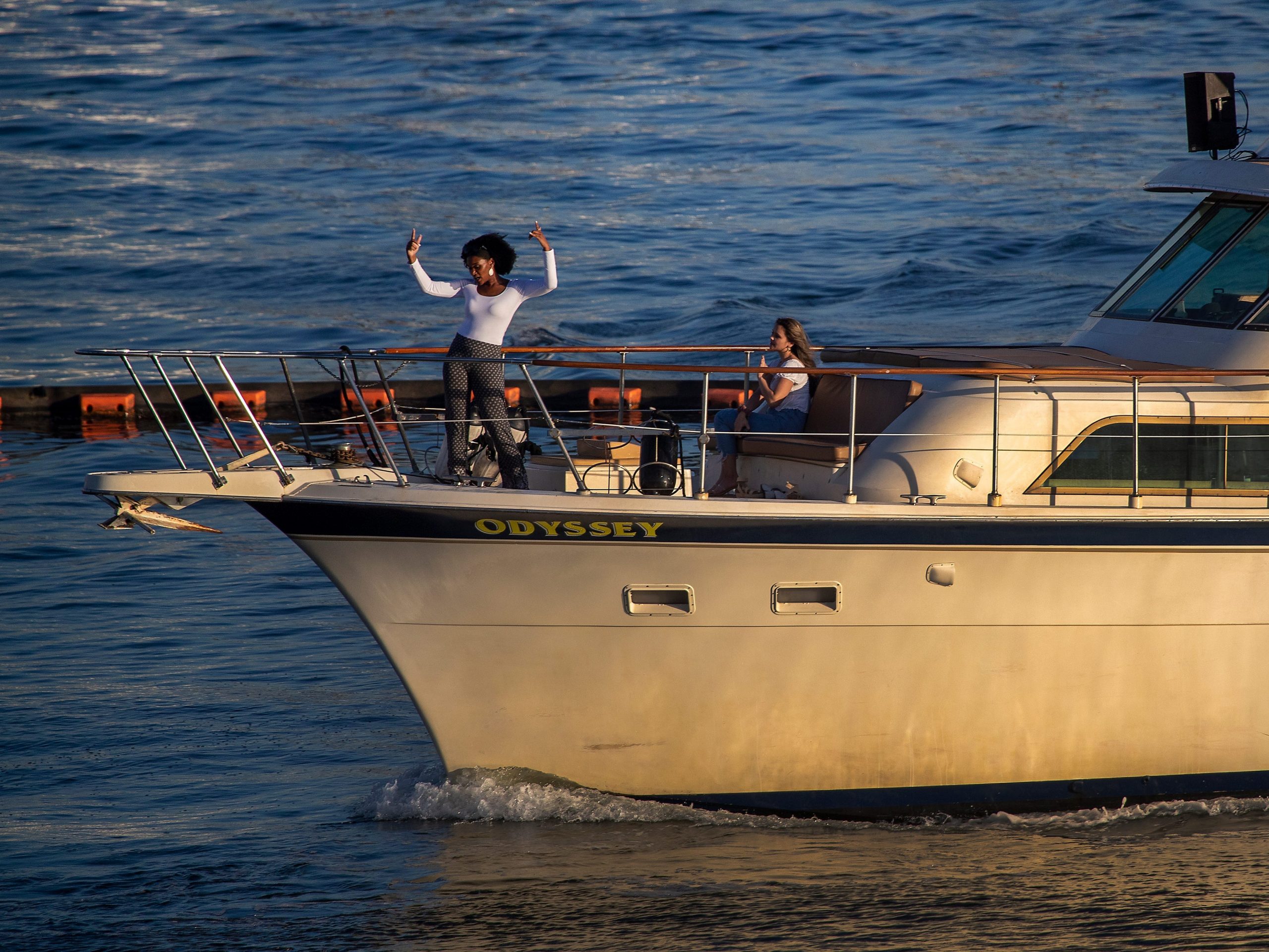 Person dancing on charter yacht