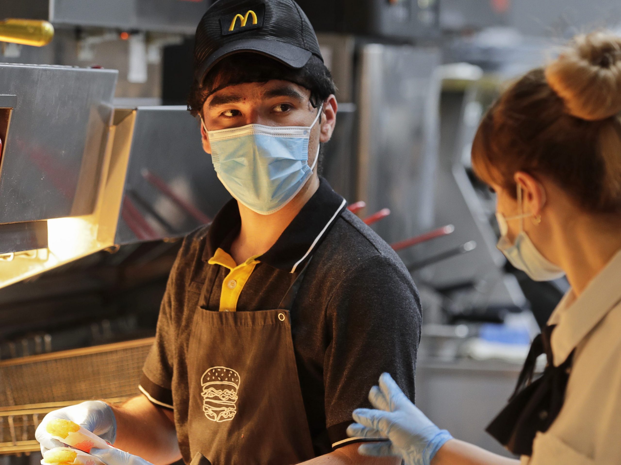 A member of staff works in the kitchen of a McDonald's restaurant in central Moscow.