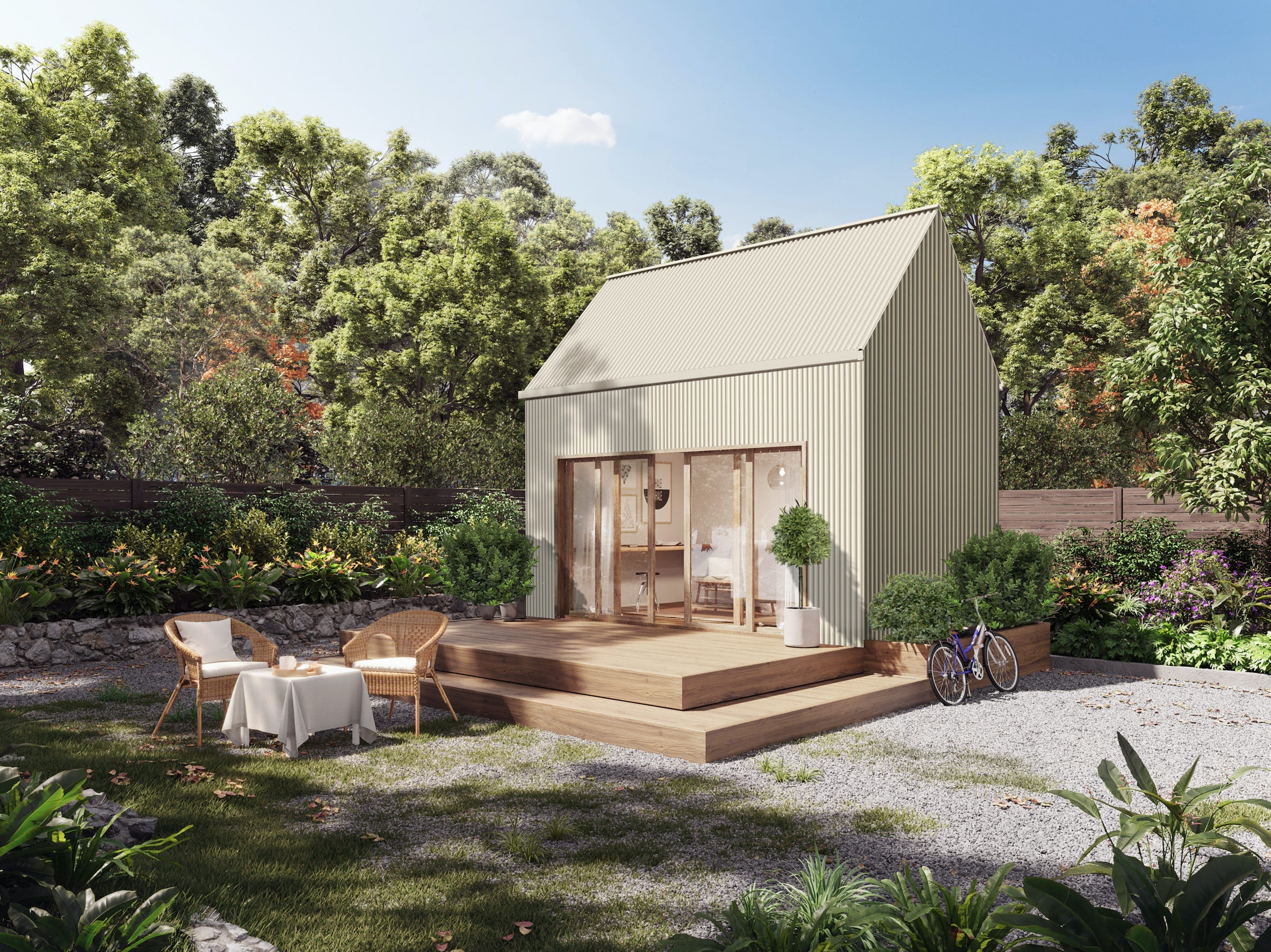 The exterior of the Coexist Traveler build among trees and outdoor seating