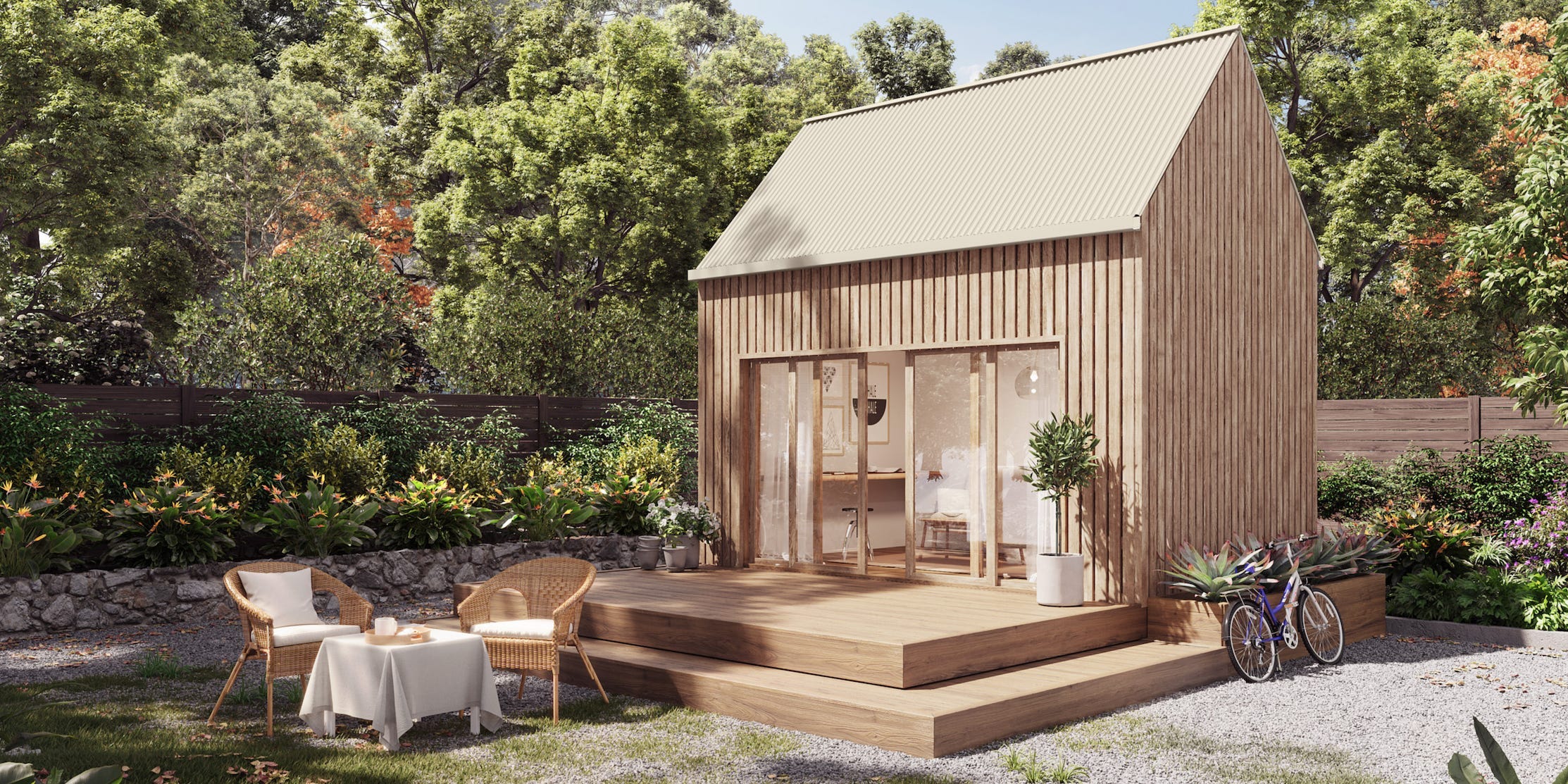 The exterior of the Coexist Traveler build among trees and outdoor seating