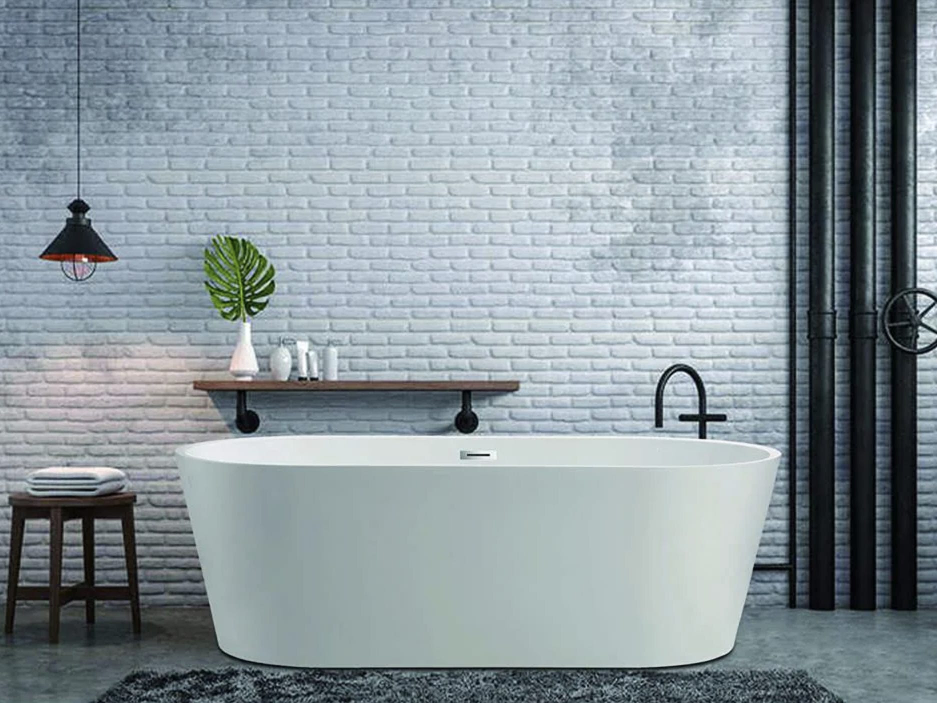 white freestanding bathtub in front of a tiled wall testing methodology for best bathtubs in 2021