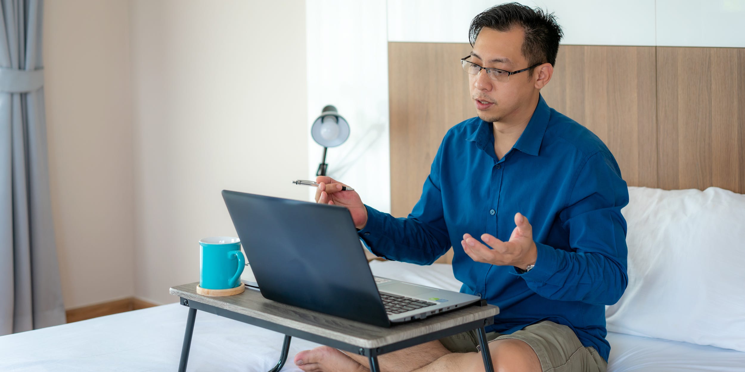 Business professional doing online presentation on laptop at home video call