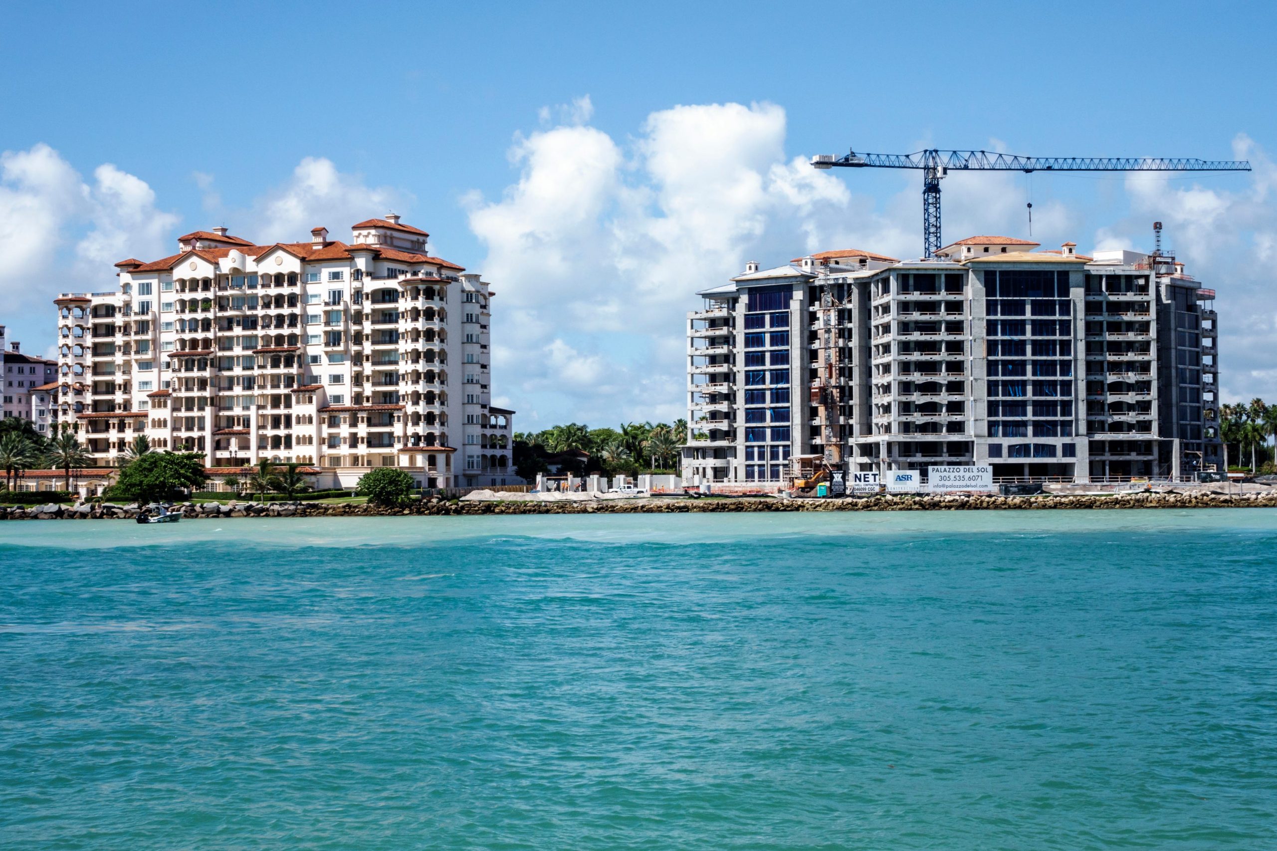 Two luxury condominium buildings under construction on Fisher Island in Miami, Florida.