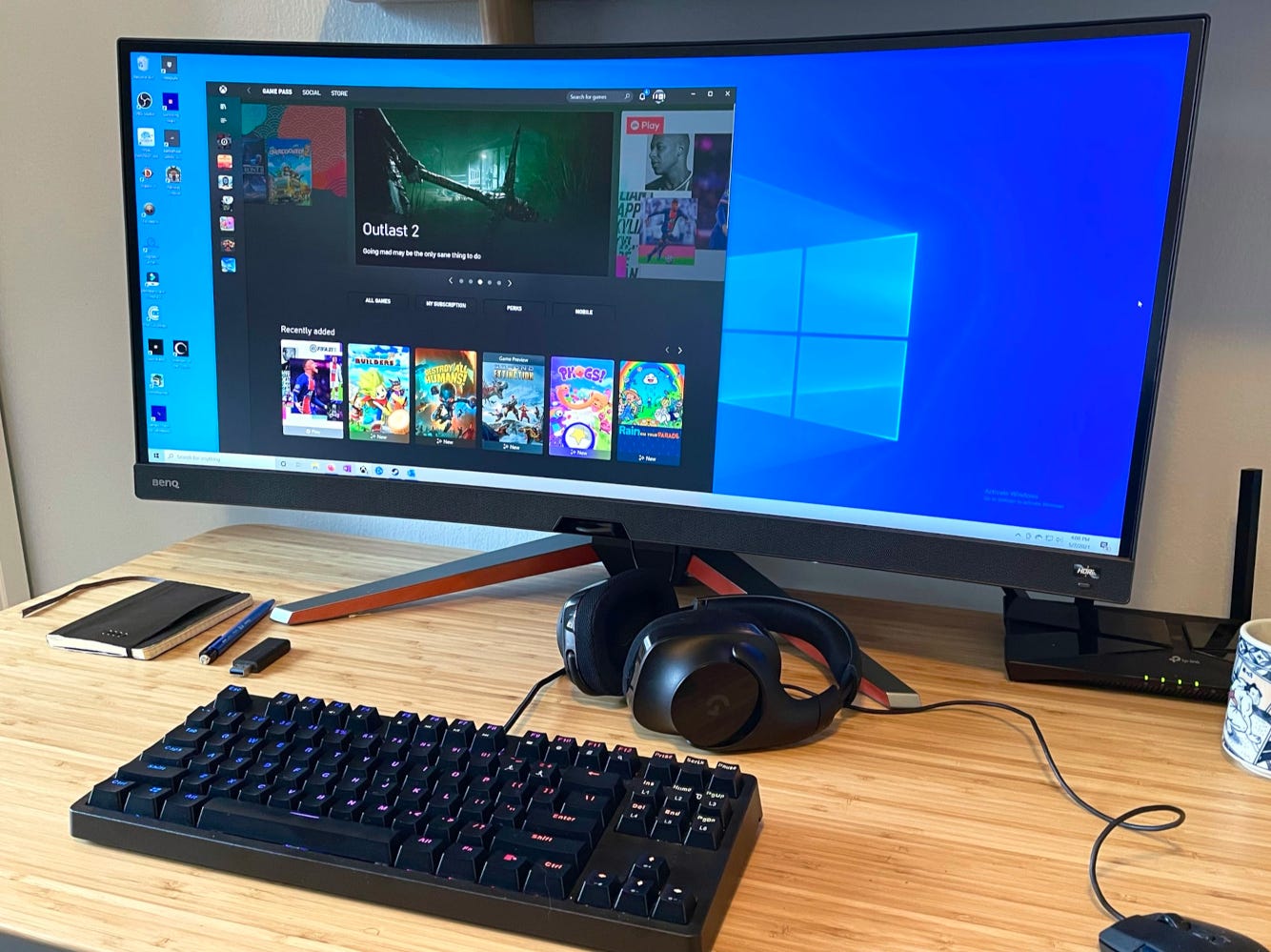 The best ultra-wide gaming monitor - BenQ Mobiuz EX3415R monitor sitting on a wooden desk