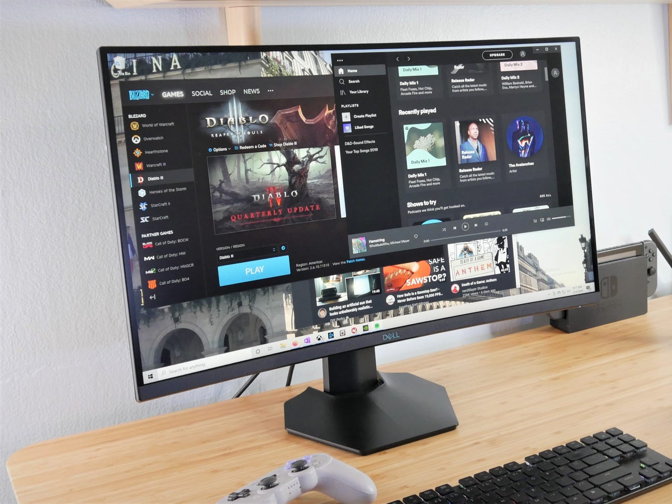 Dell's 2721HGF sitting on a desk with games and music open on the screen