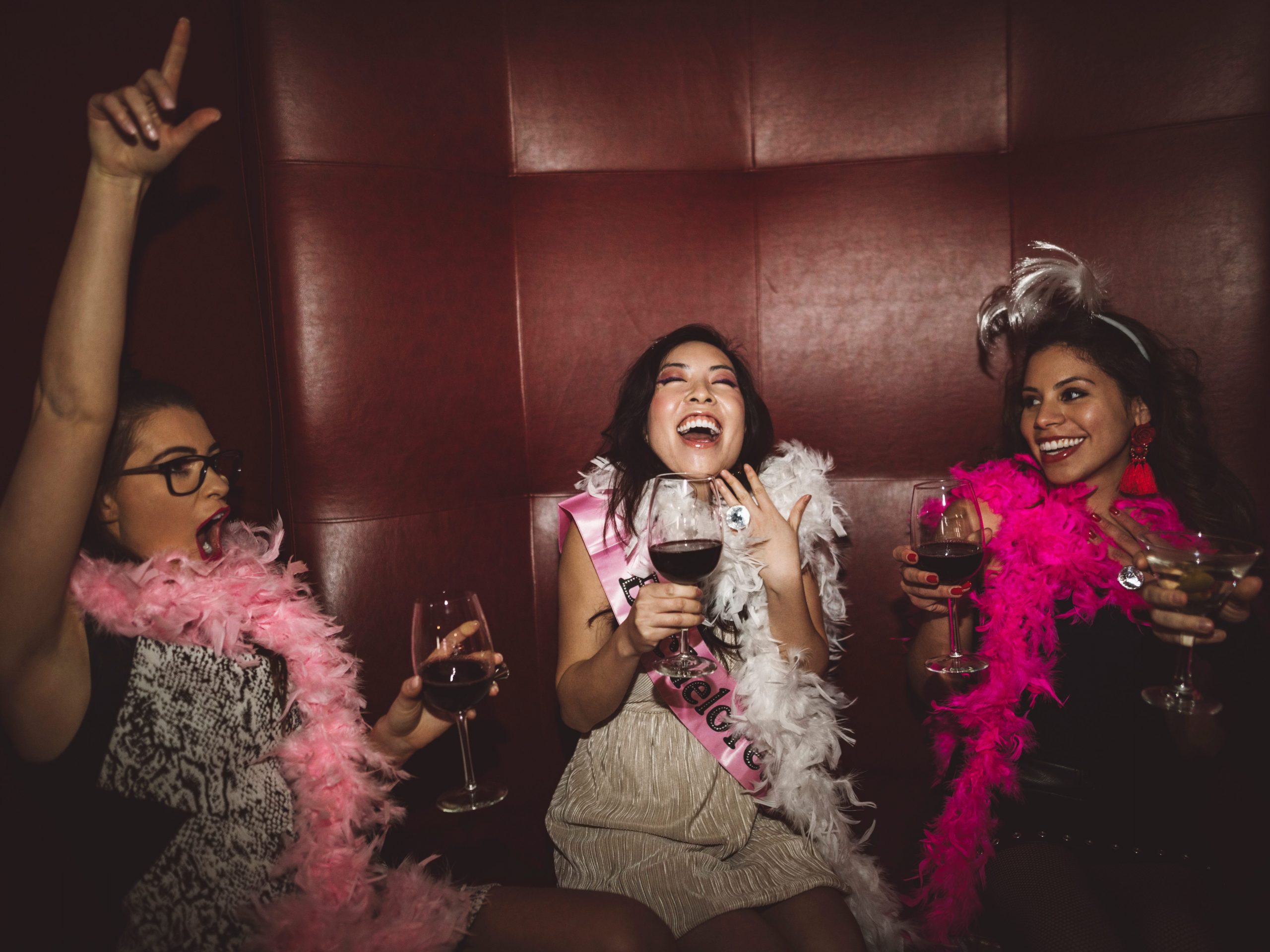 bachelorette party girls wearing feather boas