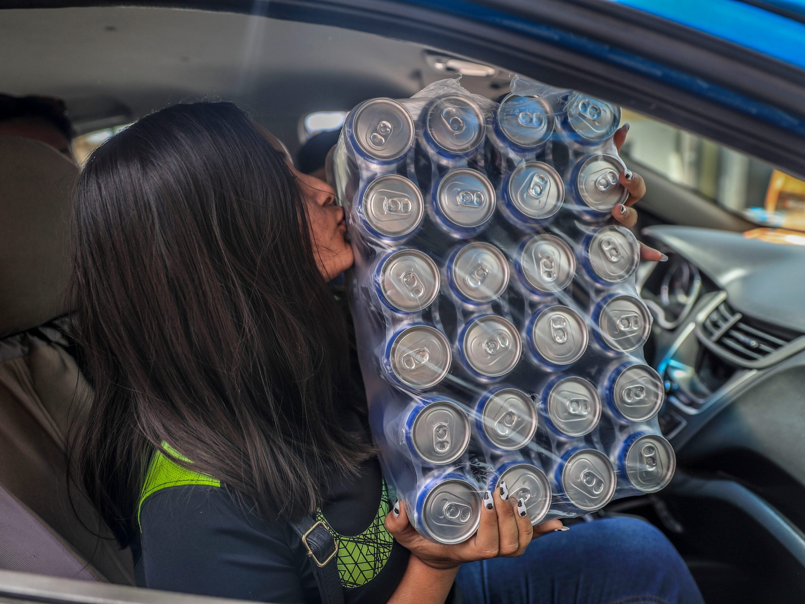 woman kissing 24 pack beer