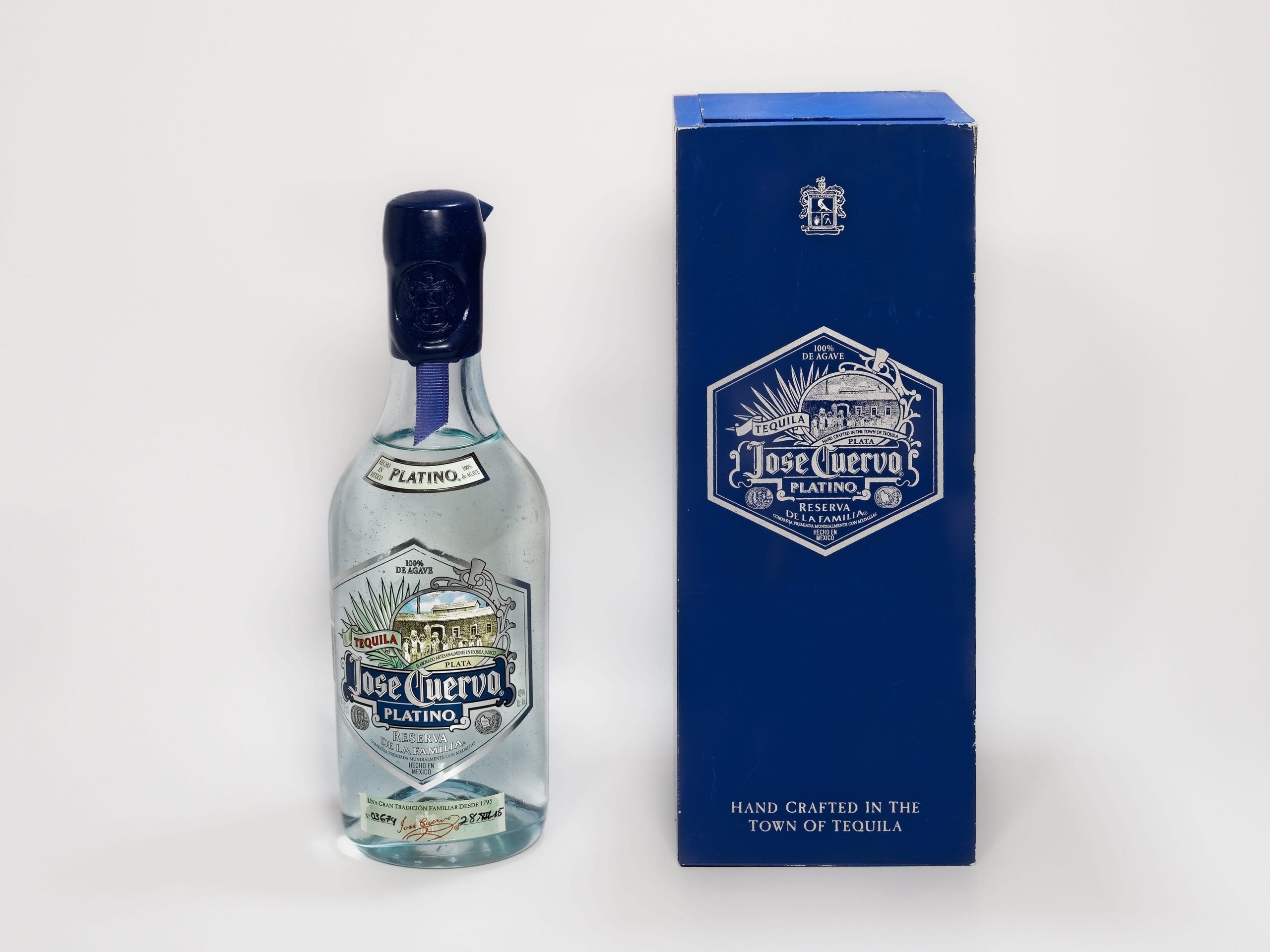 Jose Cuervo tequila bottle with wax seal and wooden box